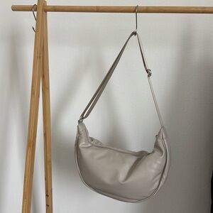 Uniqlo collection with Clare Waight Keller. Round shoulder bag.